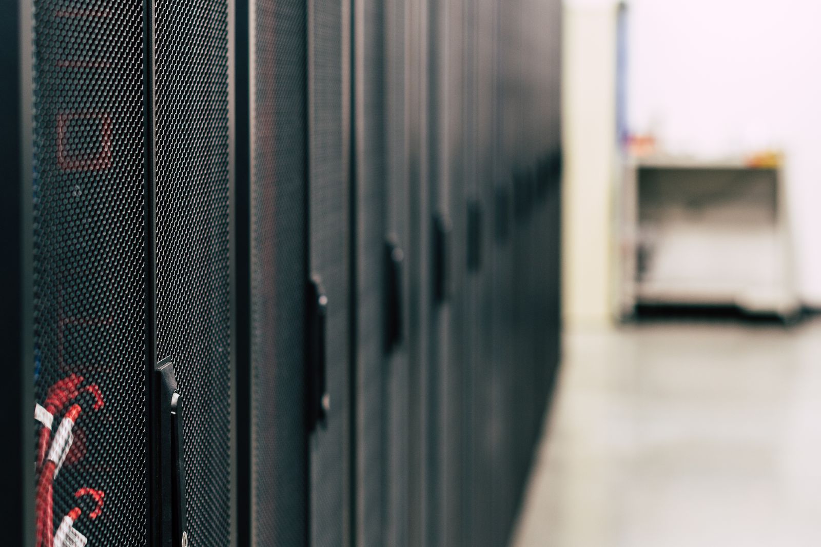 Row of equipment cabinets in a data centre.